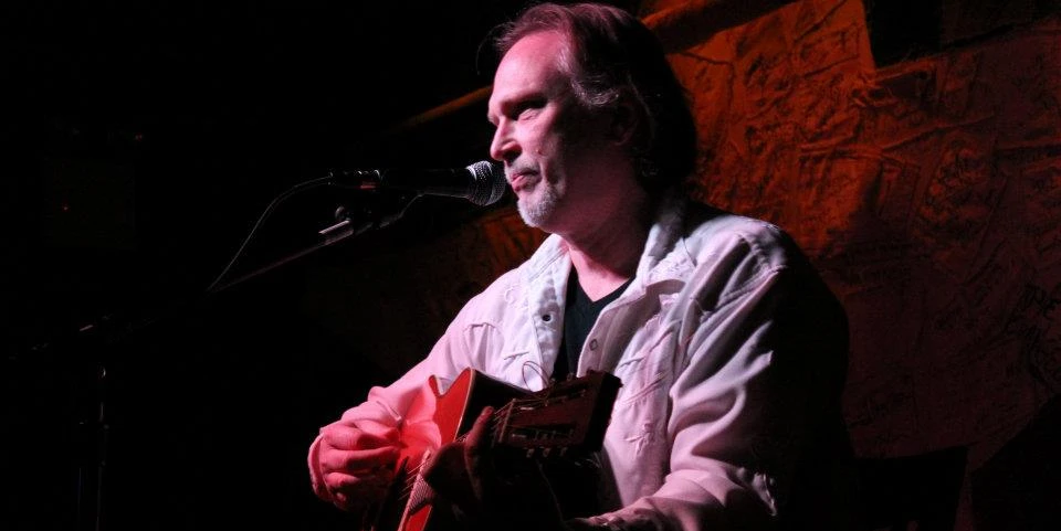 Roger Alan on stage singing