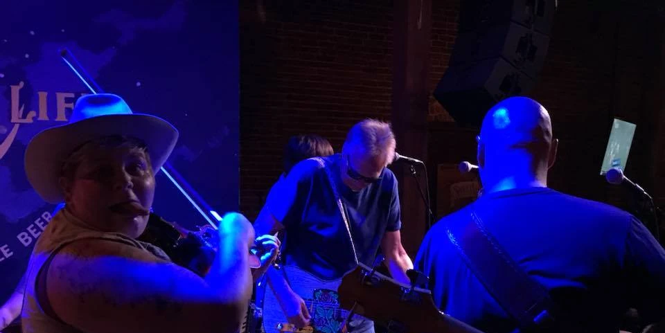 Roger Alan, bald man and smiling man with a violin